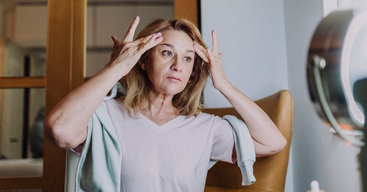 A mature woman practicing her skincare routine, emphasizing self-care and wellness.